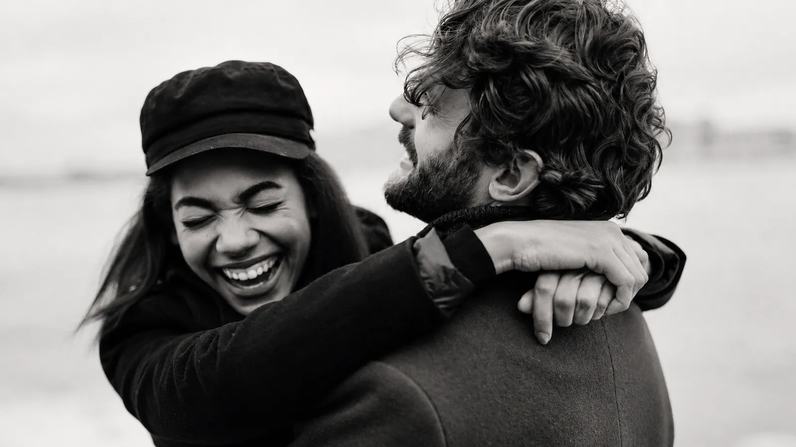 Happy couple embracing and laughing together